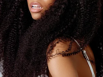 A Close Portrait Of Long Spiral Black Hair Women